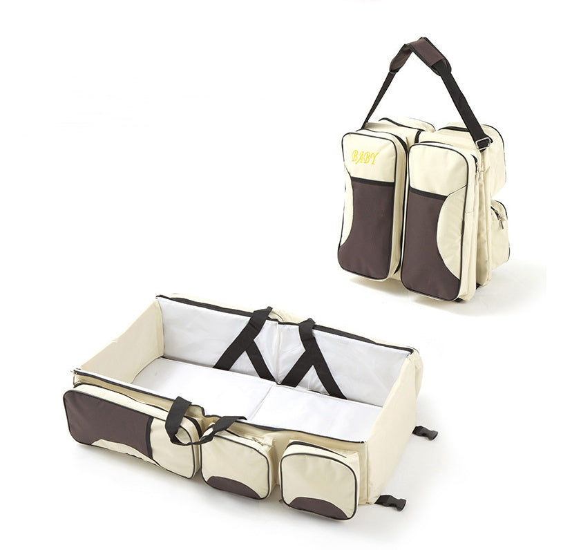 Wickeltasche mit faltbarem Babybett
