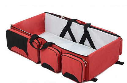 Wickeltasche mit faltbarem Babybett
